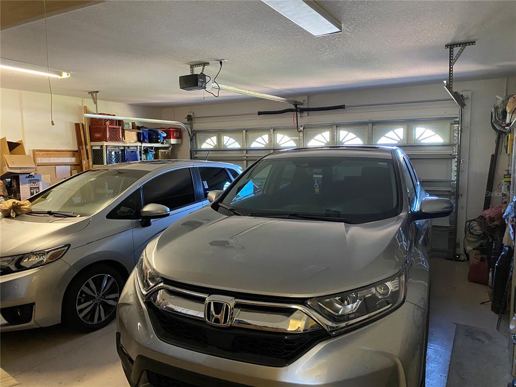 8464 Southwest 82nd Circle Ocala, FL 34481 - Photo 31 of 47 a view of a car in garage