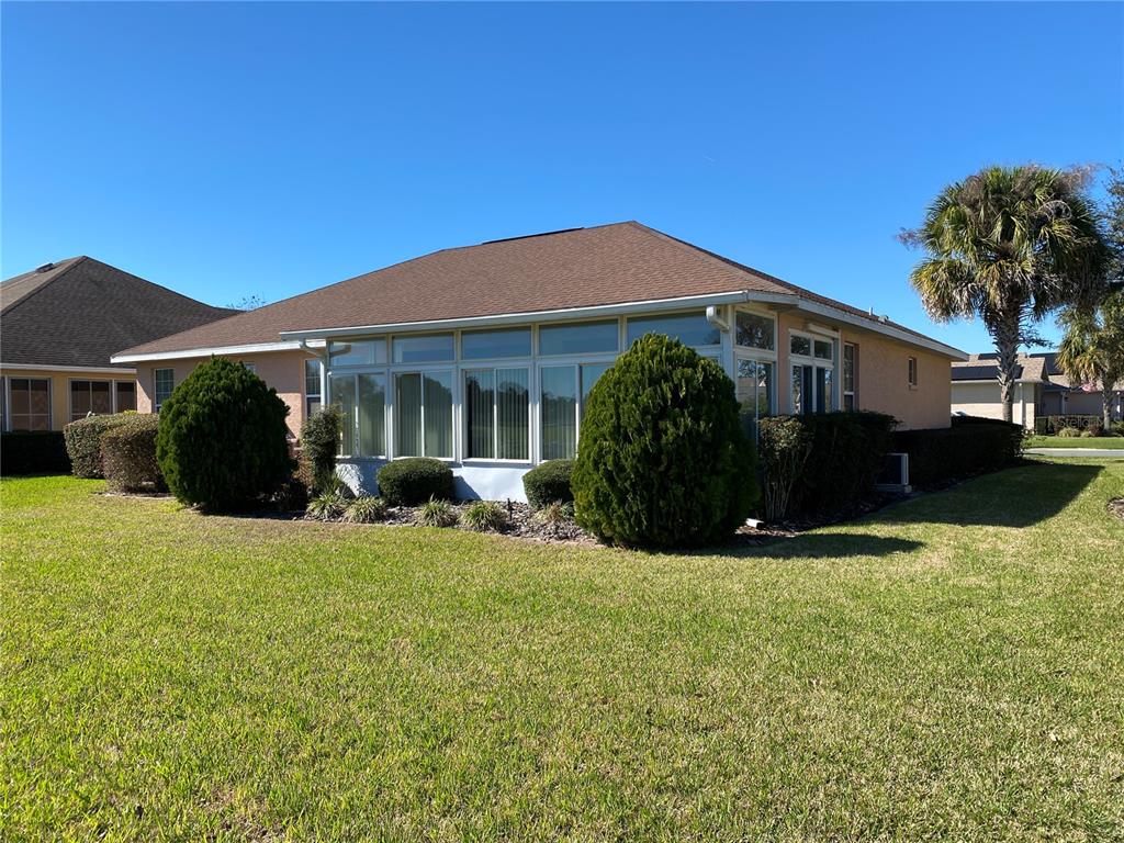 8464 Southwest 82nd Circle Ocala, FL 34481 - Photo 32 of 47 a view of a house with backyard sitting area and garden