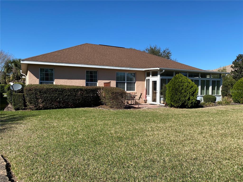 8464 Southwest 82nd Circle Ocala, FL 34481 - Photo 33 of 47 a front view of a house with garden