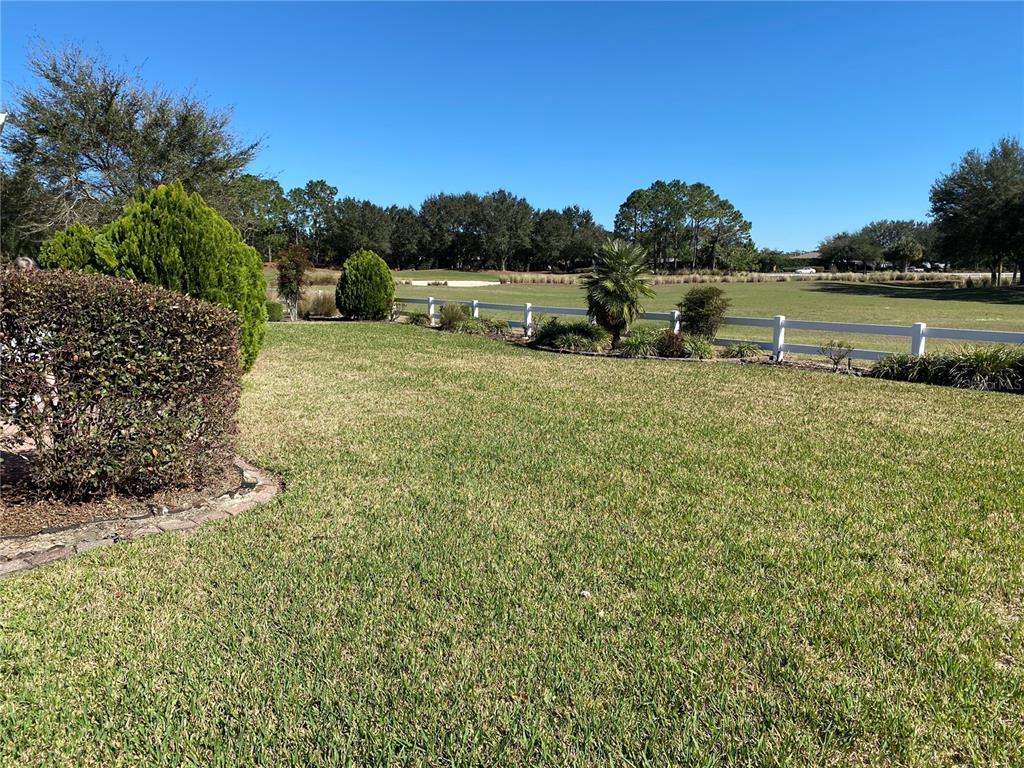 8464 Southwest 82nd Circle Ocala, FL 34481 - Photo 35 of 47 a view of a lake with houses in the back