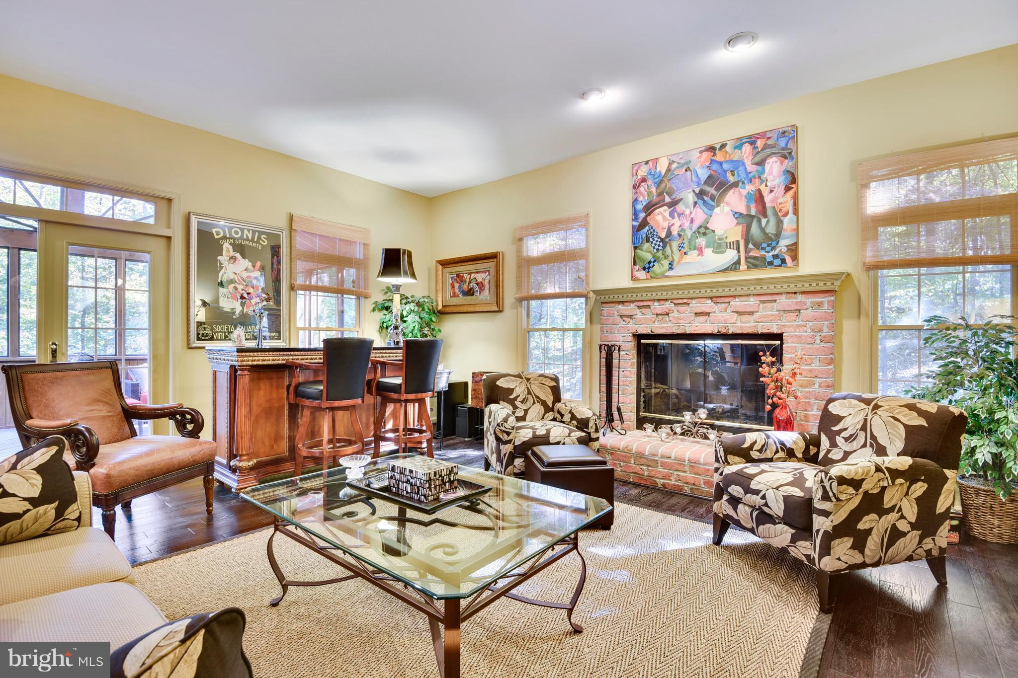 5607 South Bend Road Baltimore, MD 21209 - Photo 12 of 30 a living room with furniture a fireplace and windows