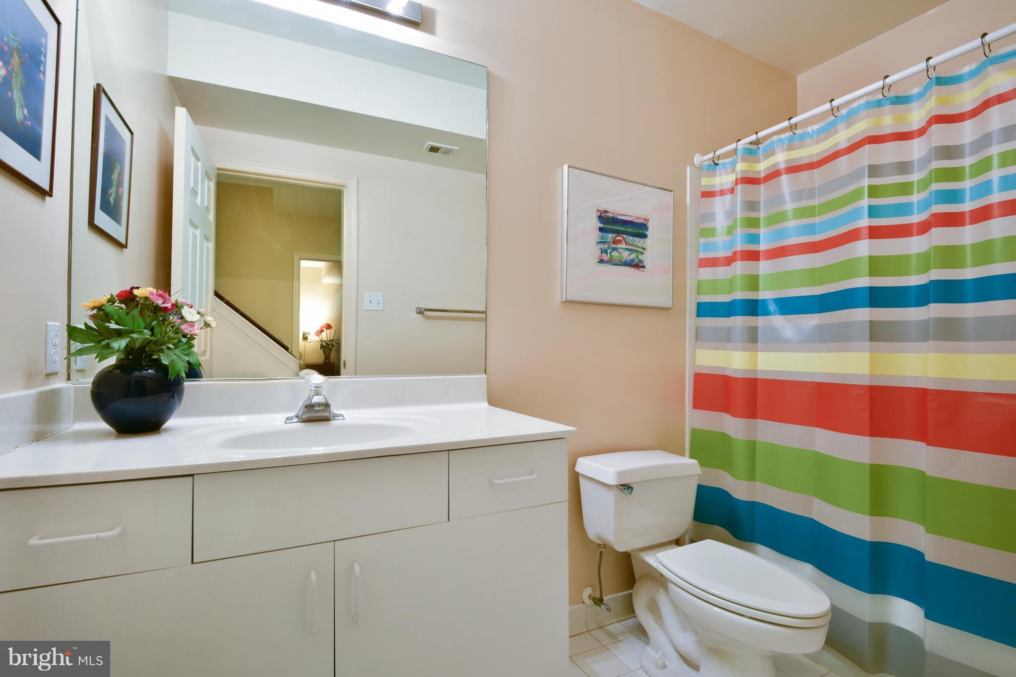 5607 South Bend Road Baltimore, MD 21209 - Photo 26 of 30 a bathroom with a toilet sink and mirror