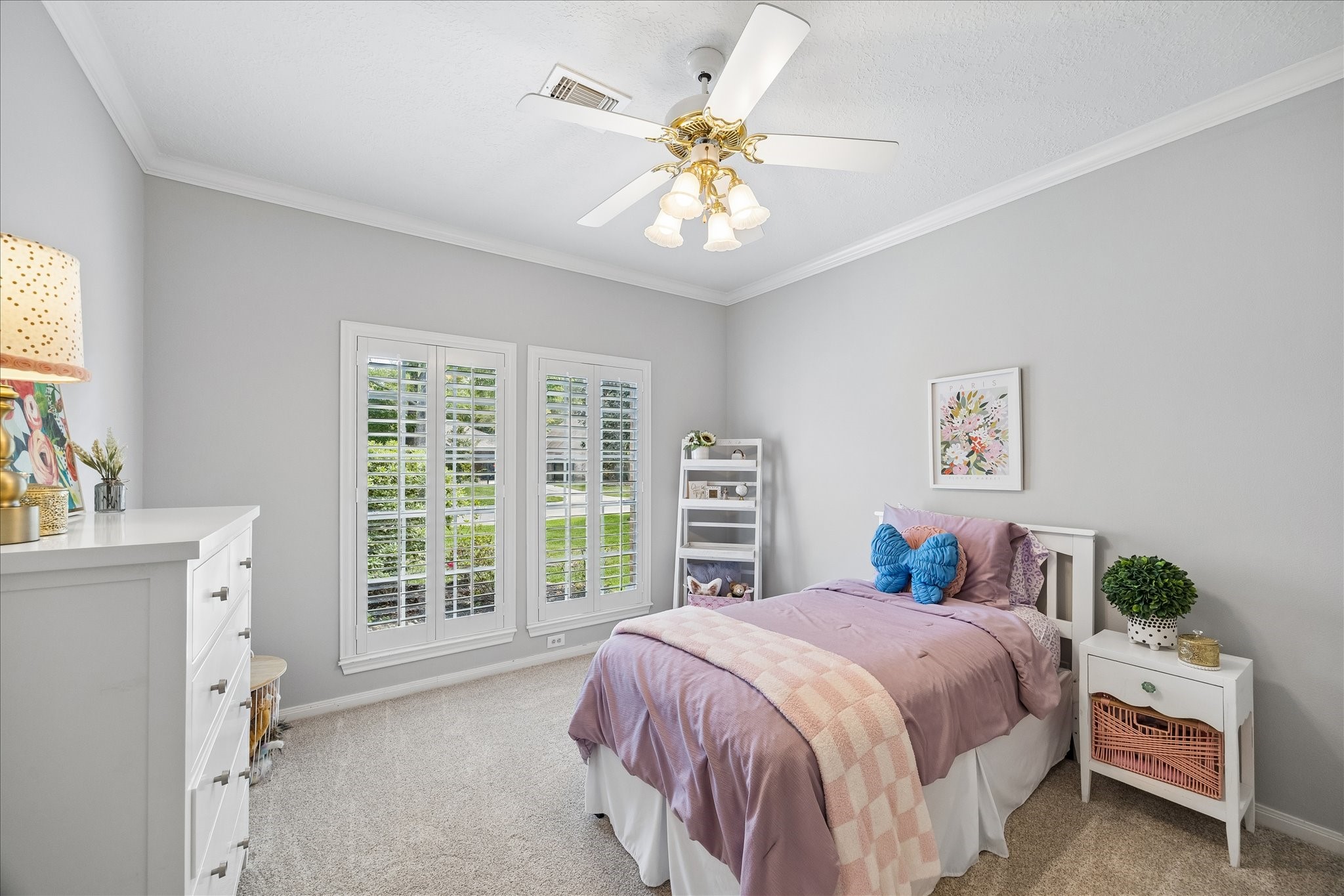 2810 Timber Country Way Kingwood, TX 77345 - Photo 23 of 30 a bedroom with a large bed and a chandelier