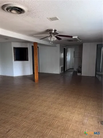 a view of a livingroom with a staircase