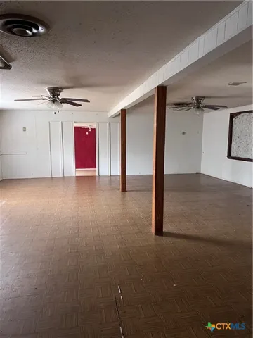 a view of a livingroom with wooden floor