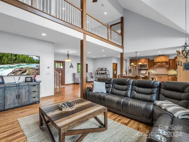 a large dining space with furniture window and wooden floor