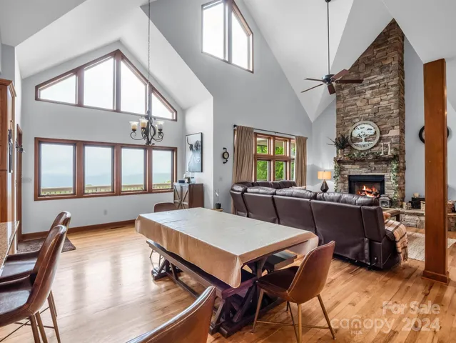 a large kitchen with a table and chairs