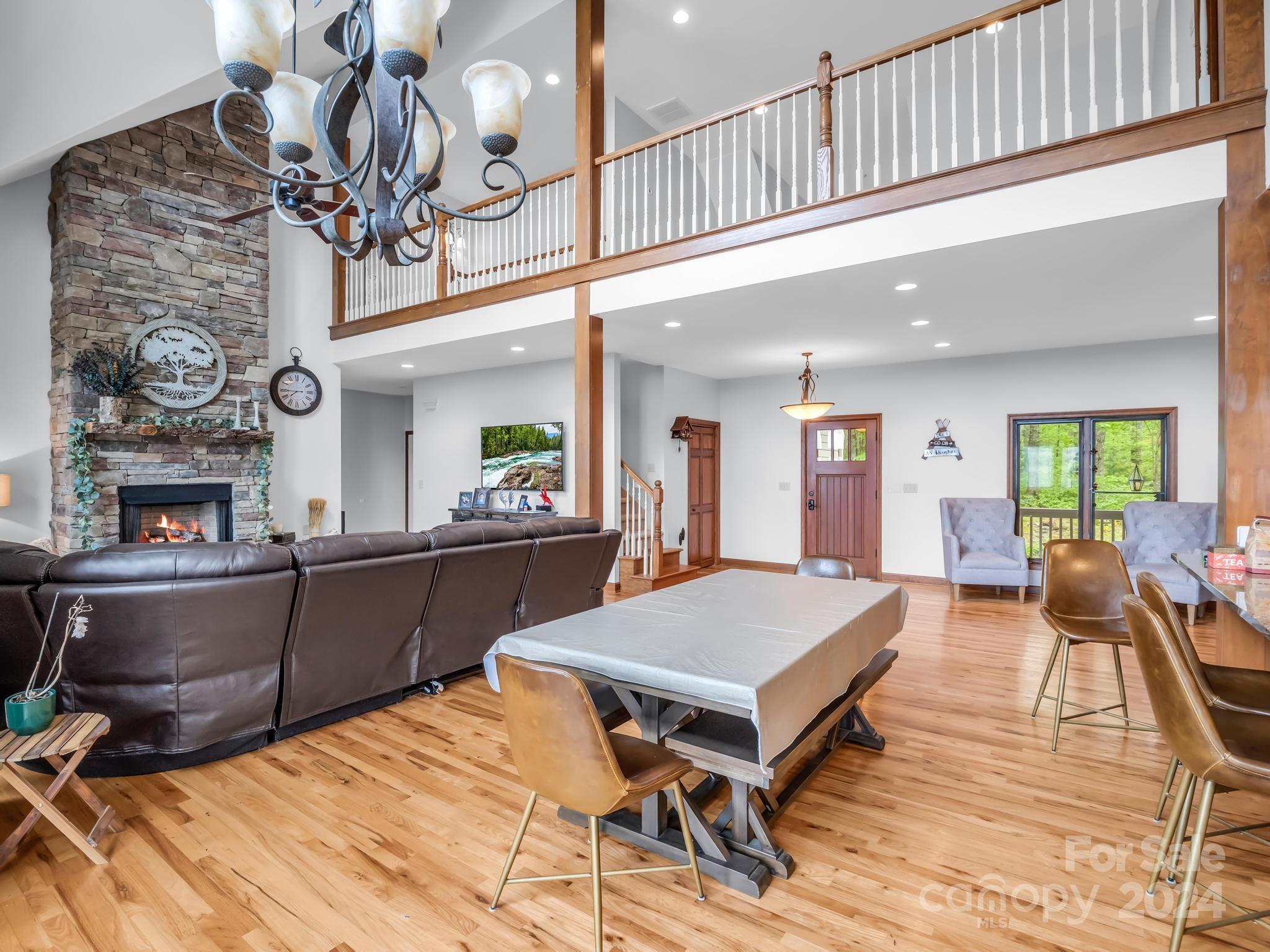 428 Devils Hole Road, Unit 14 Rosman, NC 28772 - Photo 15 of 47 a large kitchen with a table and chairs