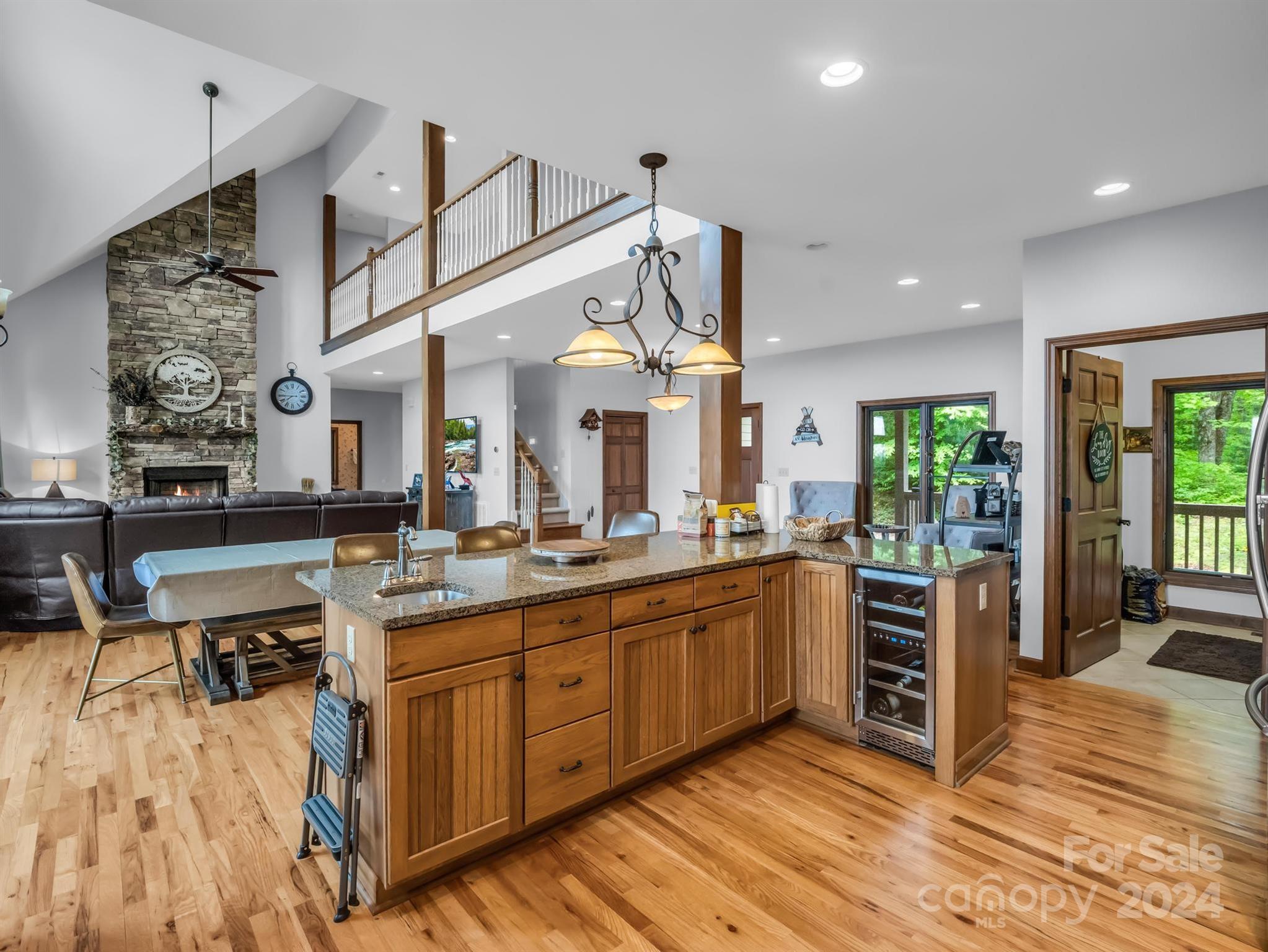 428 Devils Hole Road, Unit 14 Rosman, NC 28772 - Photo 18 of 47 a kitchen with stainless steel appliances kitchen island granite countertop a stove and cabinets