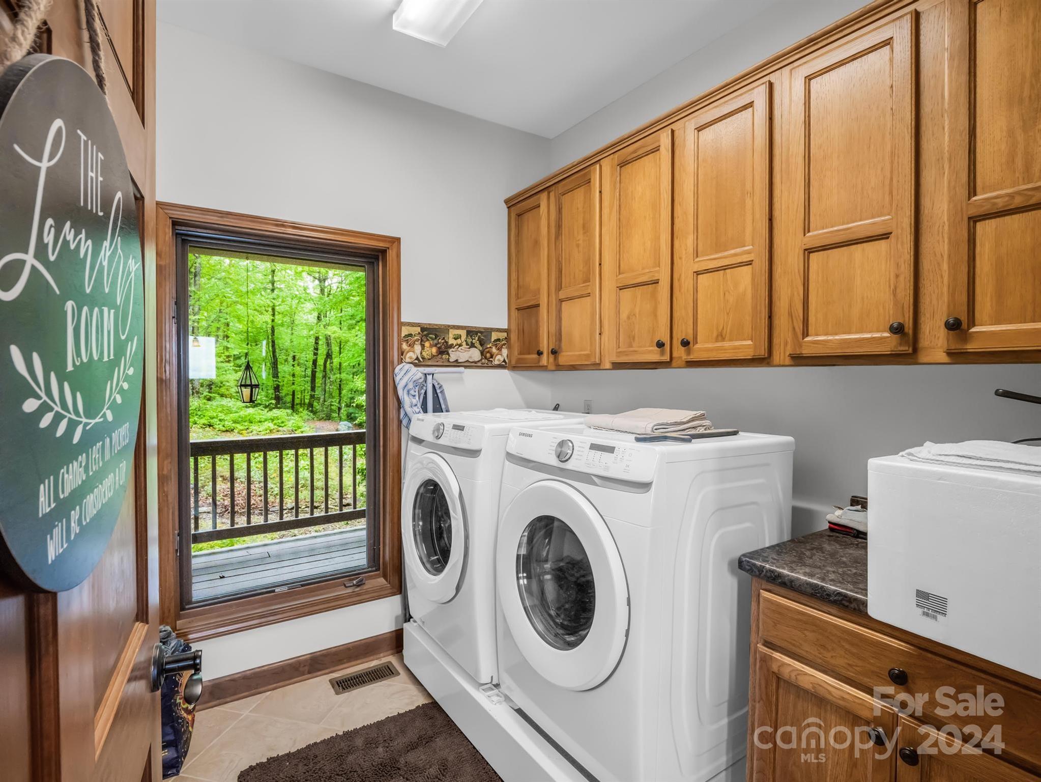 428 Devils Hole Road, Unit 14 Rosman, NC 28772 - Photo 19 of 47 a utility room with dryer and washer