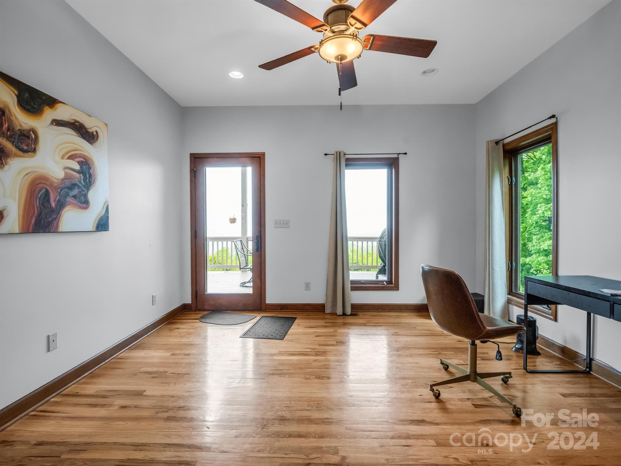 428 Devils Hole Road, Unit 14 Rosman, NC 28772 - Photo 25 of 47 a living room with furniture and a window