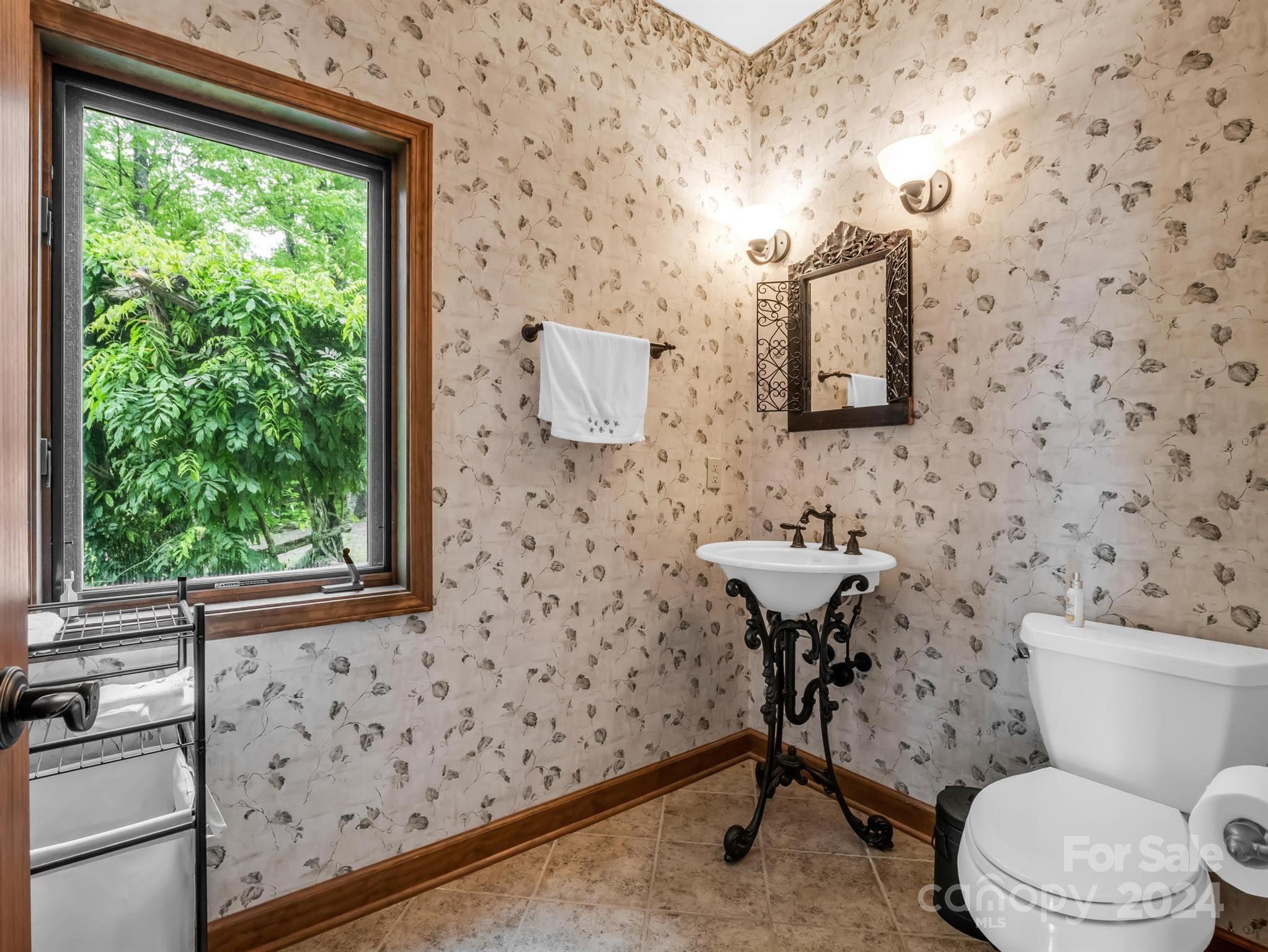 428 Devils Hole Road, Unit 14 Rosman, NC 28772 - Photo 26 of 47 a bathroom with a sink a toilet and a window