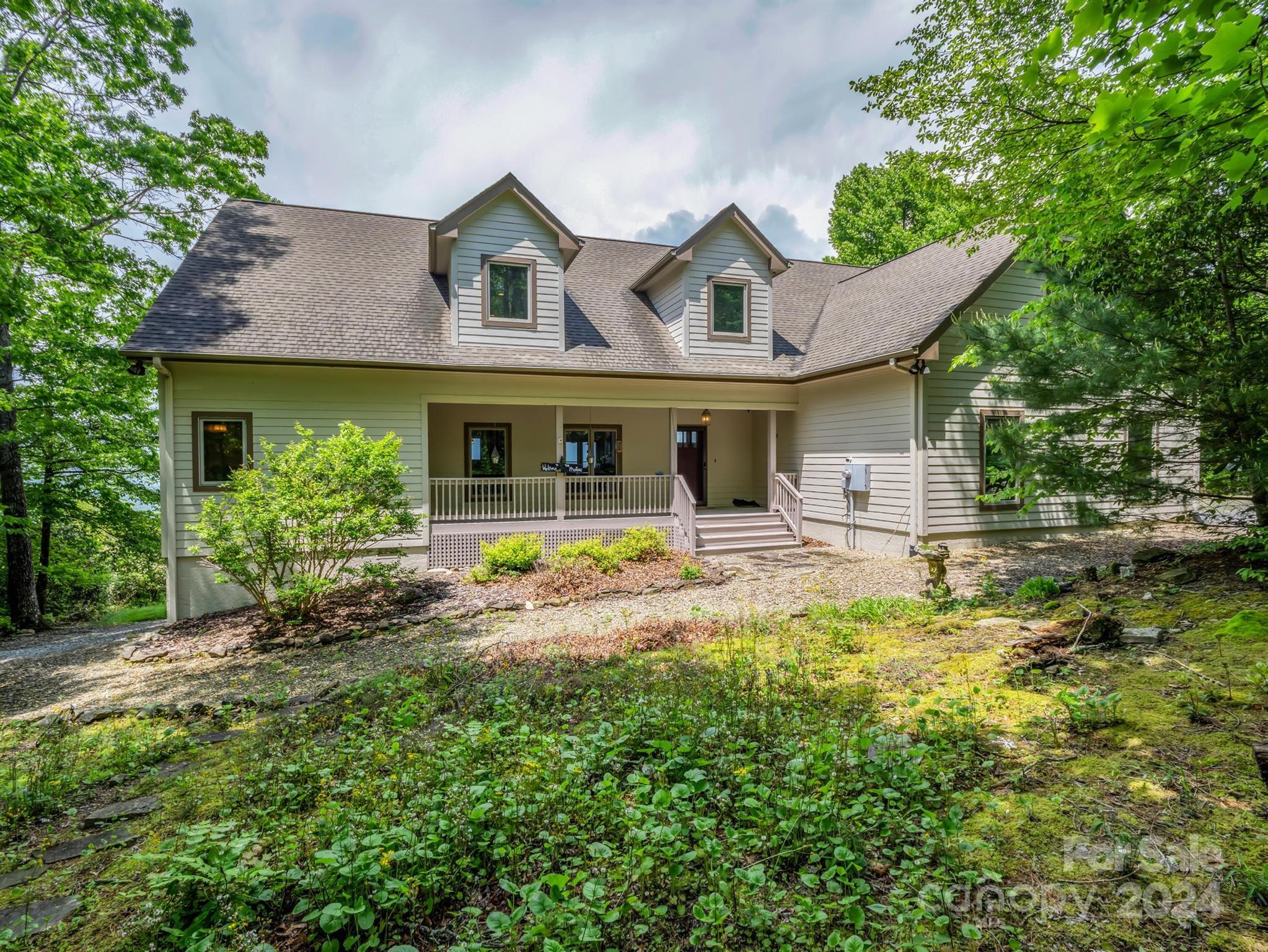 428 Devils Hole Road, Unit 14 Rosman, NC 28772 - Photo 3 of 47 a front view of a house with yard and swimming pool
