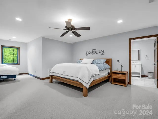 a spacious bathroom with a double vanity sink mirror and toilet