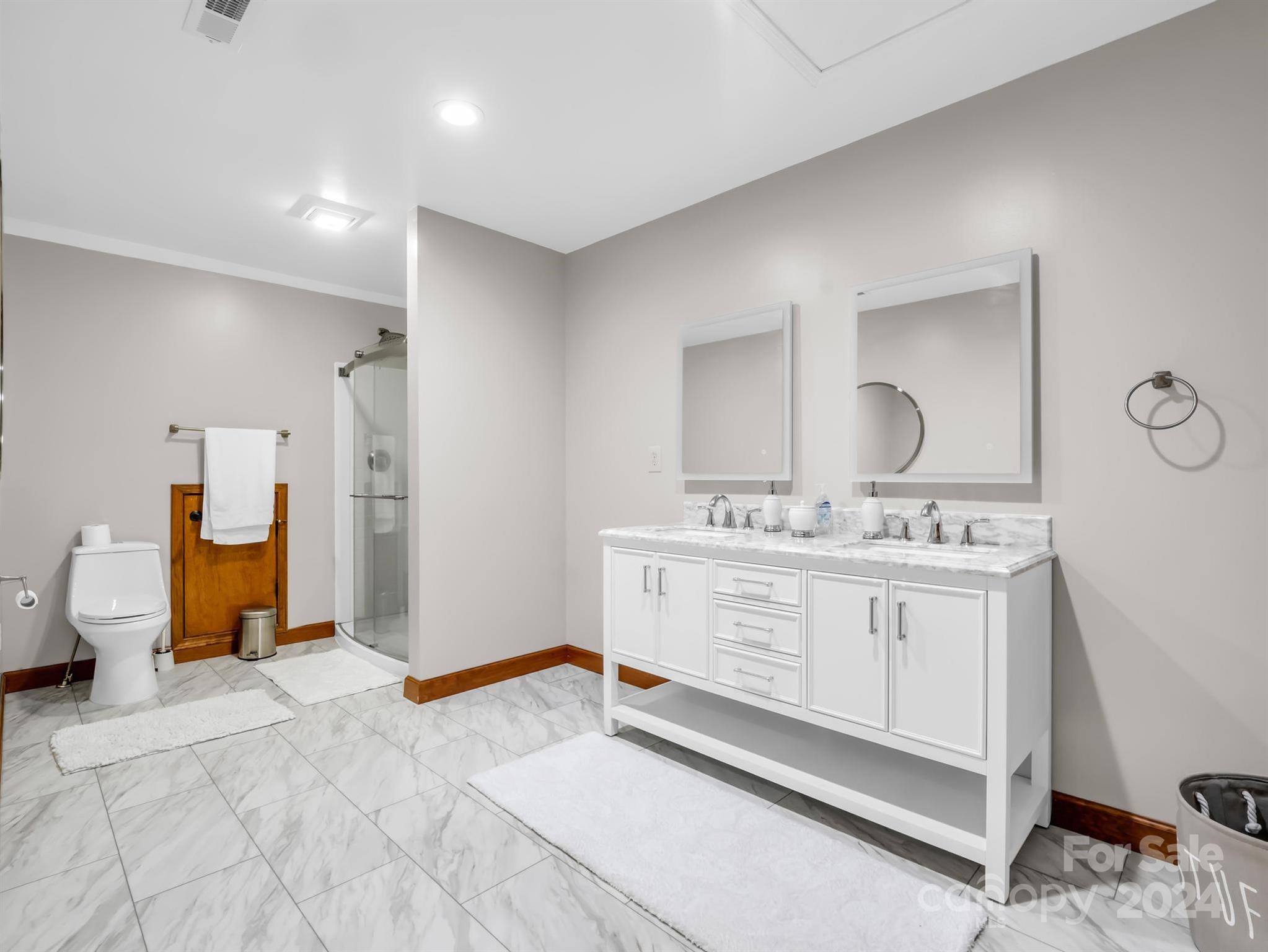 428 Devils Hole Road, Unit 14 Rosman, NC 28772 - Photo 35 of 47 a spacious bathroom with a double vanity sink mirror and toilet