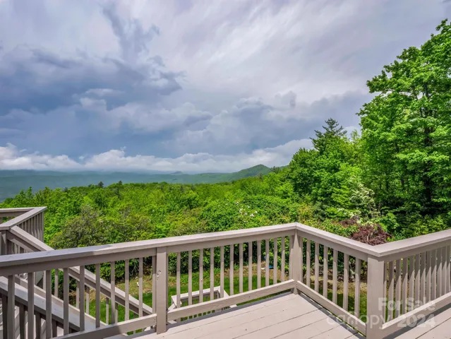a view of a balcony with wooden floor