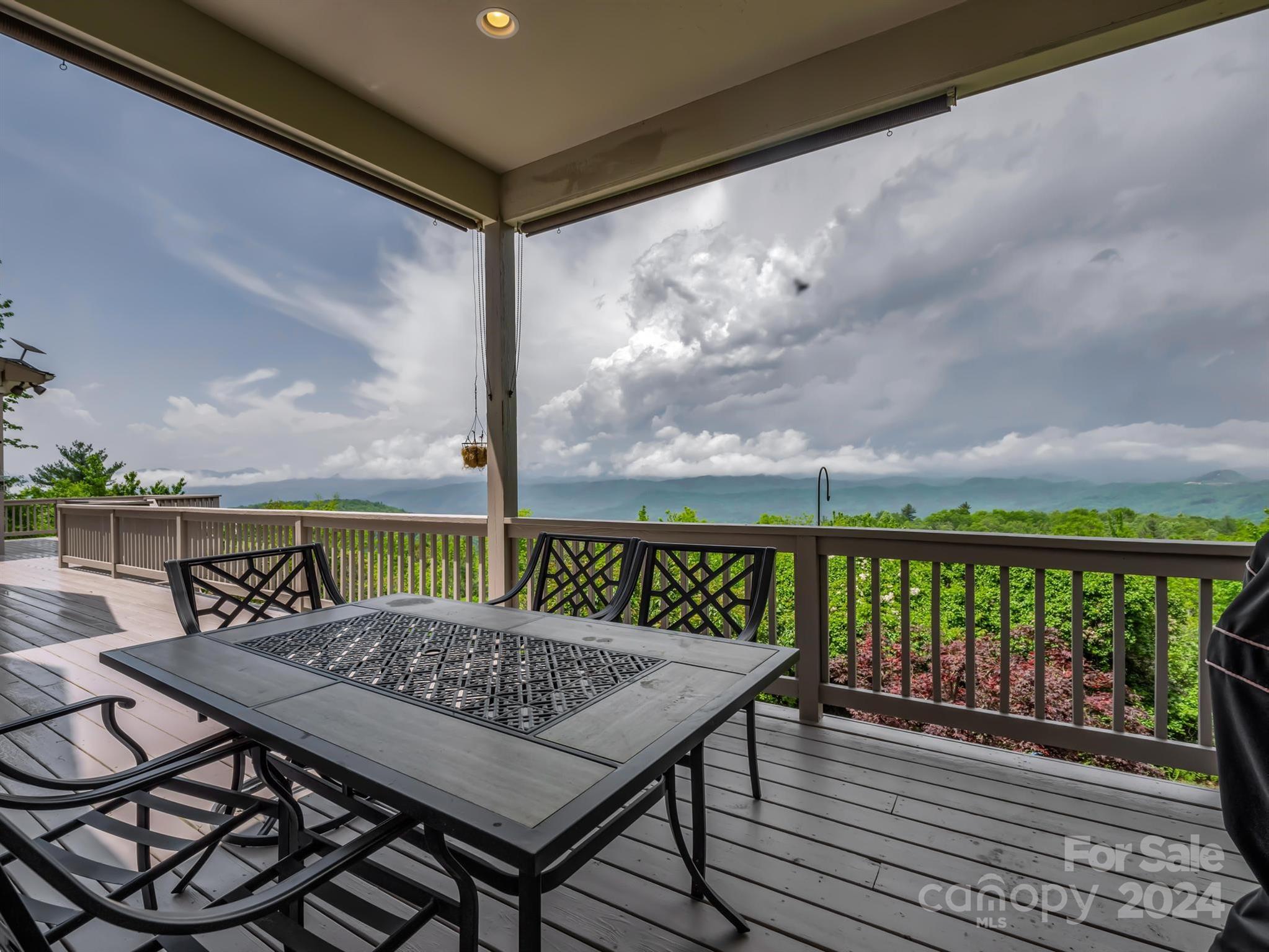 428 Devils Hole Road, Unit 14 Rosman, NC 28772 - Photo 41 of 47 a view of a balcony with wooden floor