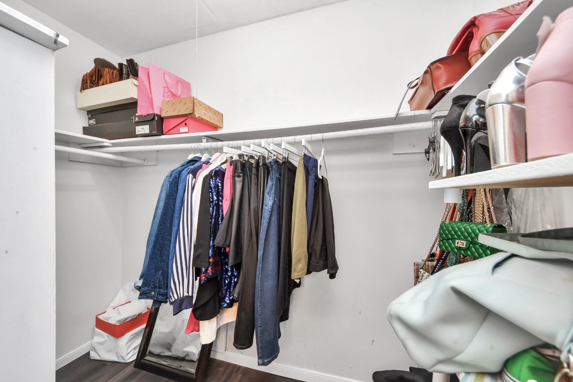 1415 Parry-Sound Pasadena, TX 77504 - Photo 25 of 39 a view of walk in closet with clothes and shoes