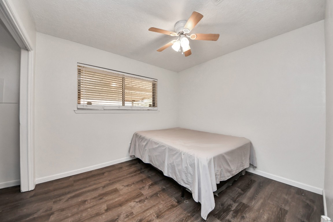 1415 Parry-Sound Pasadena, TX 77504 - Photo 27 of 39 a bed sitting in a bedroom next to a window
