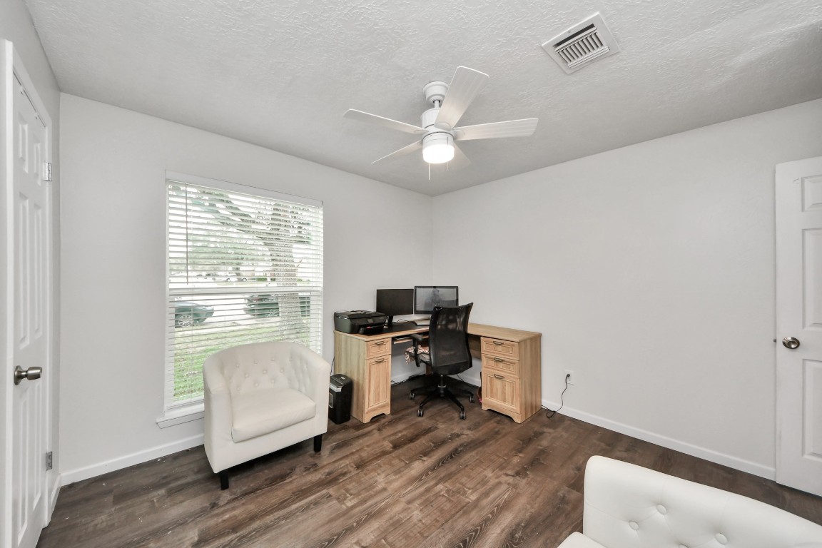 1415 Parry-Sound Pasadena, TX 77504 - Photo 32 of 39 a workspace with furniture window and wooden floor