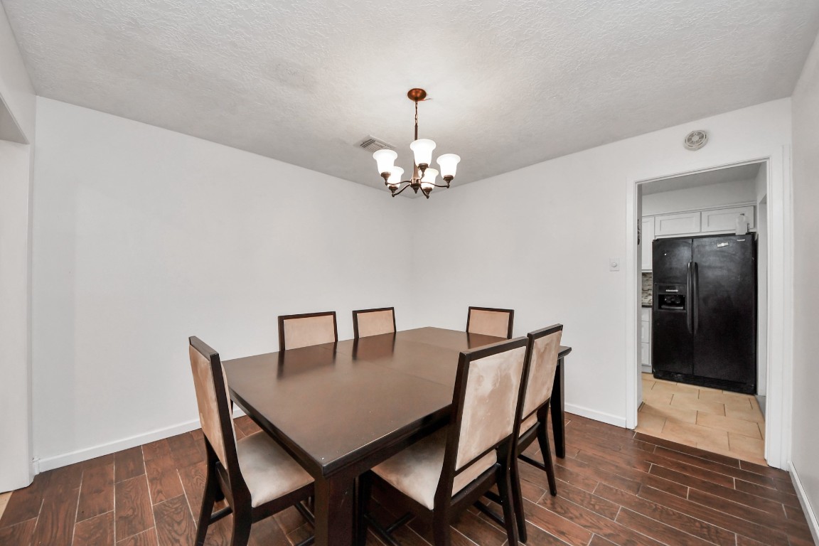 1415 Parry-Sound Pasadena, TX 77504 - Photo 7 of 39 a dining room with furniture and wooden floor
