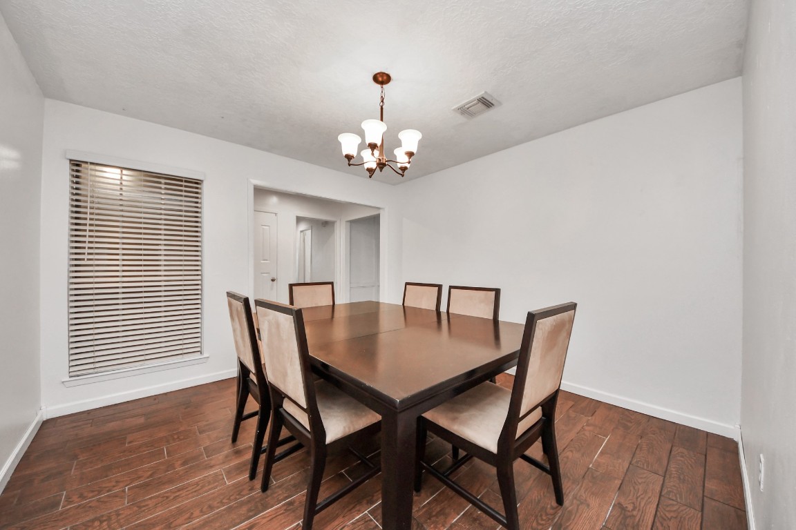 1415 Parry-Sound Pasadena, TX 77504 - Photo 8 of 39 a view of a dining room with furniture and wooden floor