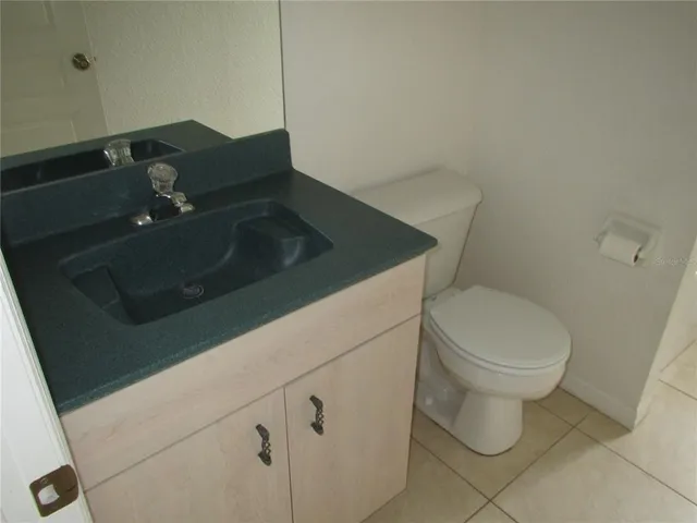 a bathroom with a toilet and a sink