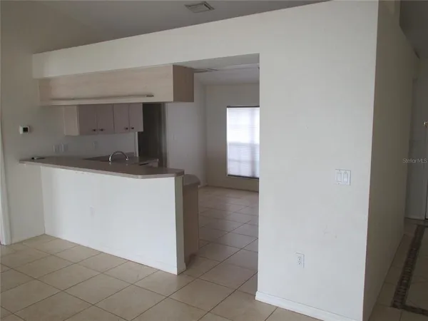 a utility room with a sink dryer and washer