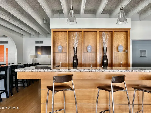 a room with lots of furniture and garden view