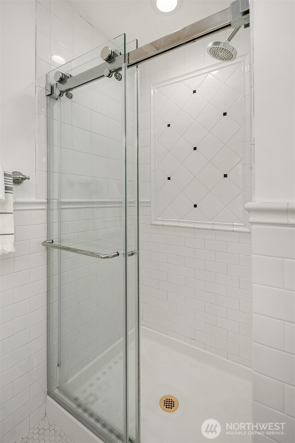 1206 East Republican Street Seattle, WA 98102 - Photo 13 of 27 a bathroom with a glass shower door