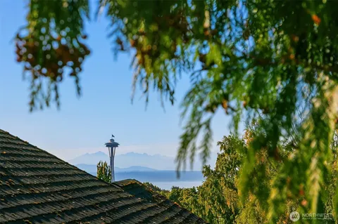 a vase of flowers sitting on a floor