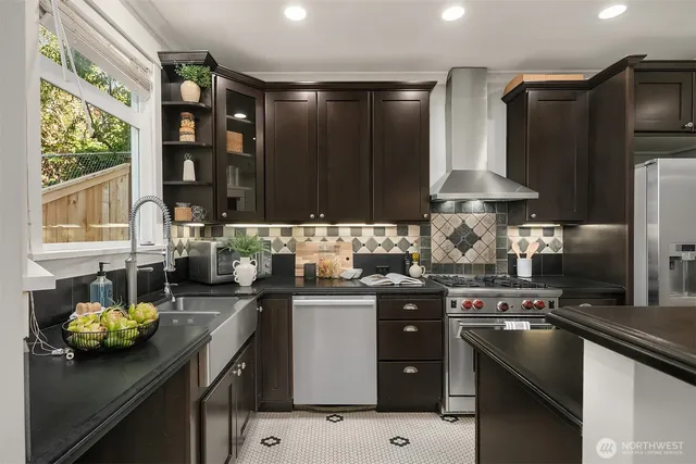 a kitchen with a sink stove and refrigerator