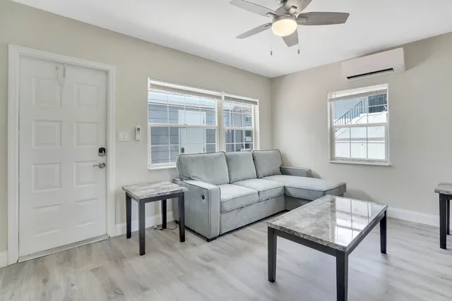 a living room with furniture and a window