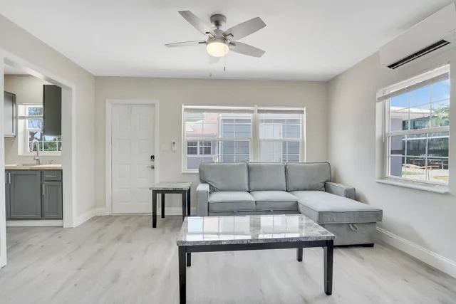 a living room with furniture and a table