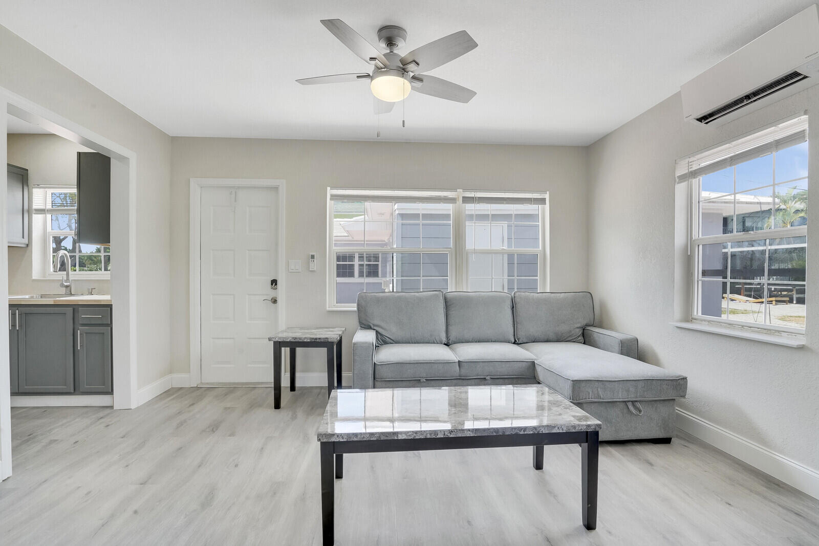 1001 South Federal Highway, Unit 3 Lake Worth Beach, FL 33460 - Photo 5 of 12 a living room with furniture and a table