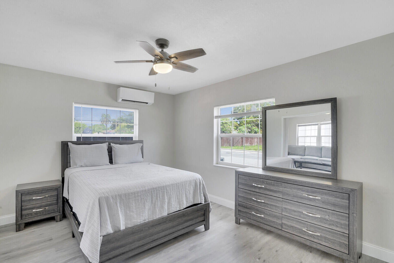 1001 South Federal Highway, Unit 3 Lake Worth Beach, FL 33460 - Photo 9 of 12 a bedroom with a bed and a window