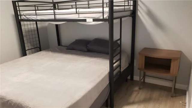 a bedroom with a bed and window