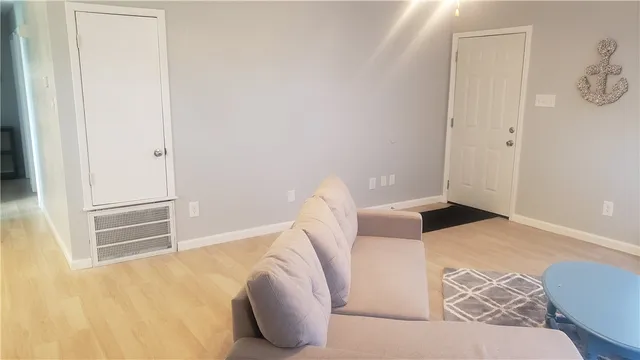 a dining room with a wooden table and chairs