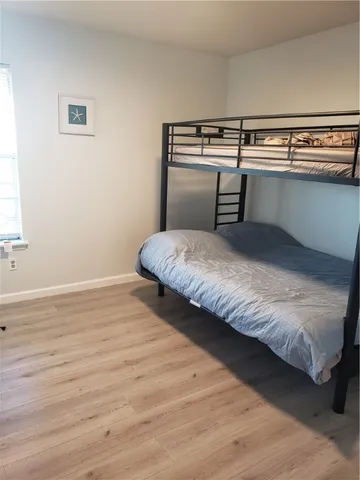 a room with a bed and a mirror