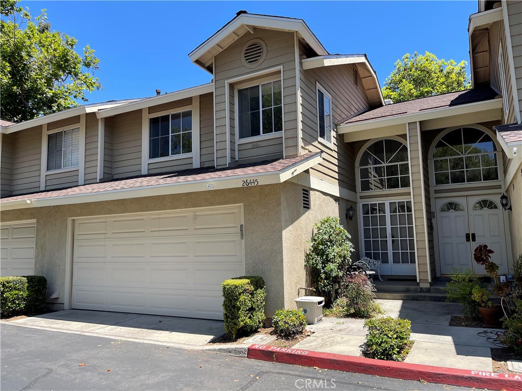 26445 Dunsmore, Unit 2 Lake Forest, CA 92630 - Photo 1 of 36 a front view of a house with garden