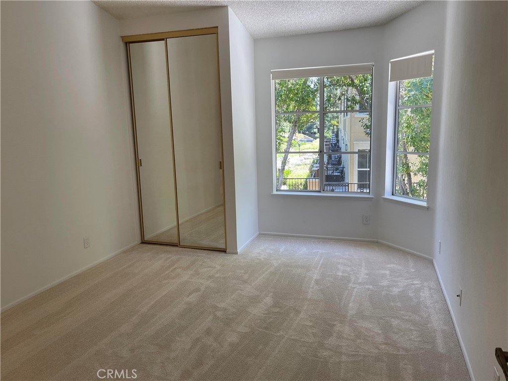 26445 Dunsmore, Unit 2 Lake Forest, CA 92630 - Photo 16 of 36 an empty room with windows