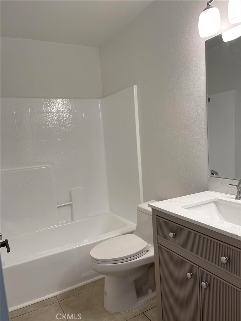 26445 Dunsmore, Unit 2 Lake Forest, CA 92630 - Photo 20 of 36 a bathroom with a sink a toilet and shower