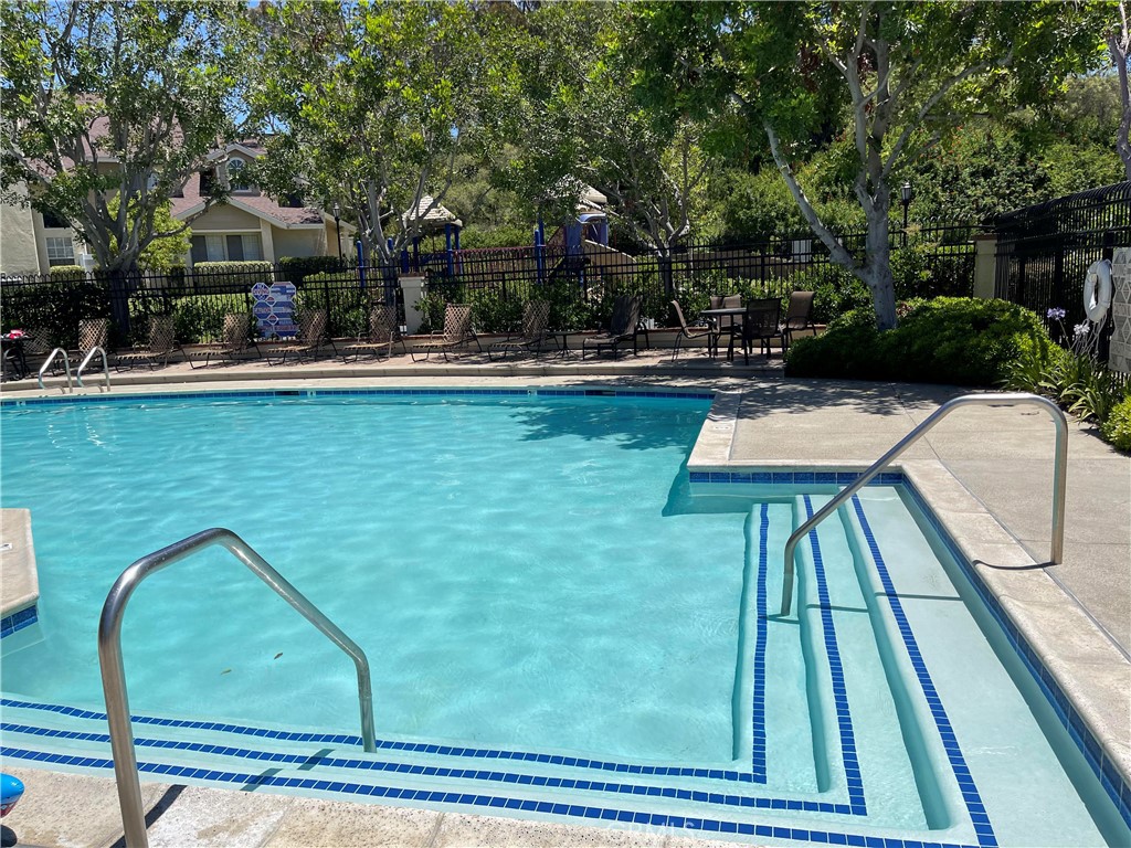 26445 Dunsmore, Unit 2 Lake Forest, CA 92630 - Photo 36 of 36 a view of swimming pool with outdoor seating and plants