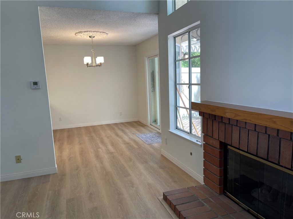 26445 Dunsmore, Unit 2 Lake Forest, CA 92630 - Photo 9 of 36 wooden floor in an empty room with a window