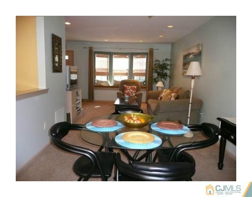 1203 Timber Oaks Road Edison, NJ 08820 - Photo 3 of 25 a view of a dining room with furniture