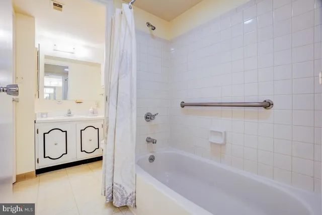 a bathroom with a bathtub and shower
