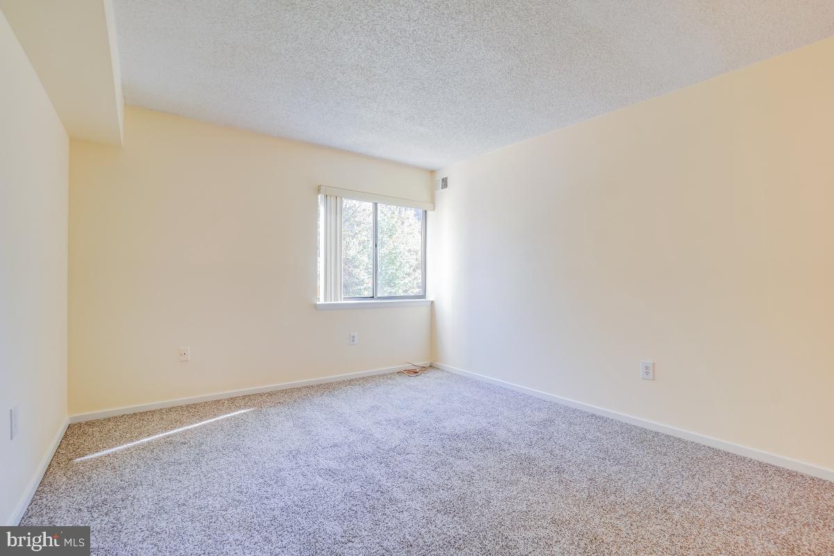 2921 North Leisure World Boulevard, Unit 1226 Silver Spring, MD 20906 - Photo 25 of 34 an empty room with windows