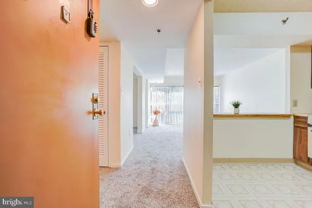 a view of a hallway view with wooden floor and staircase