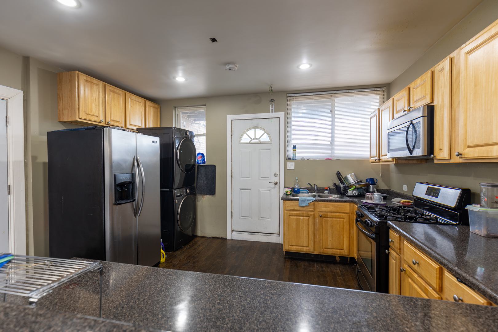5820-24 West Roosevelt Road Chicago, IL 60644 - Photo 13 of 25 a kitchen with stainless steel appliances granite countertop a refrigerator a stove and a sink