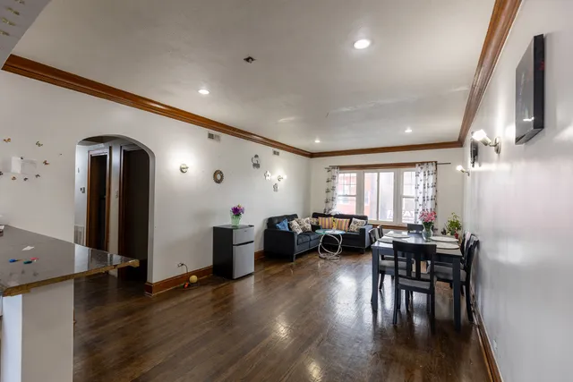 a view of a dining room with furniture window and wooden floor